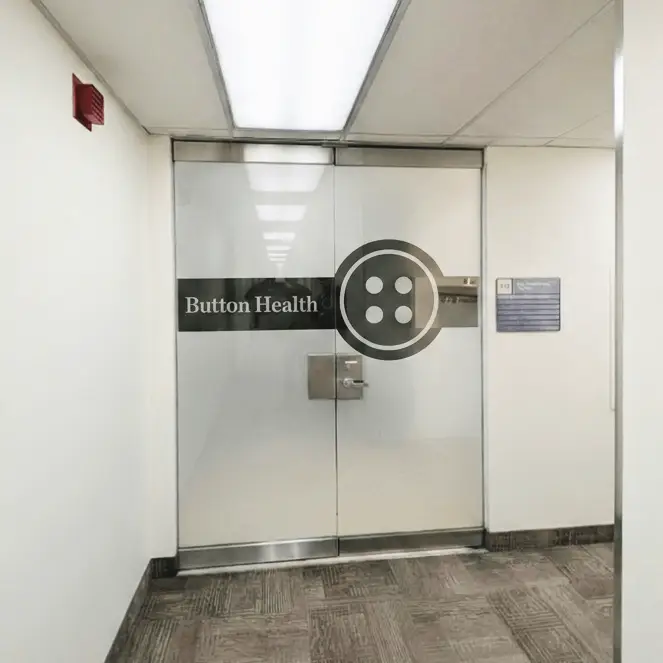 The Button Health entrance doors at 790 Bay St #536, Toronto