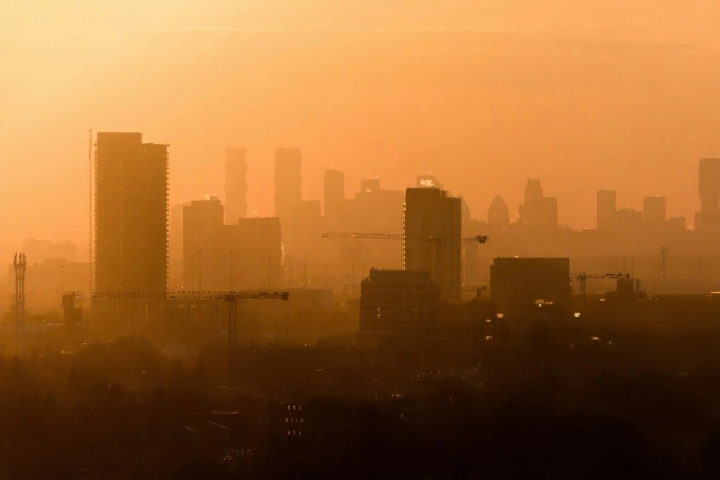 Hazy orange sky over the Toronto skyline during a wildfire smoke advisory